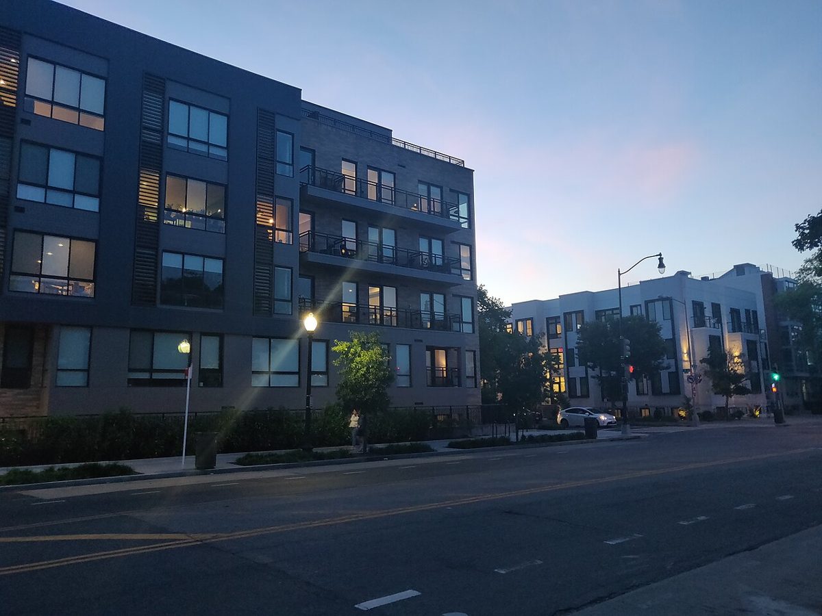 A modern apartment building at dusk in Washington, D.C.