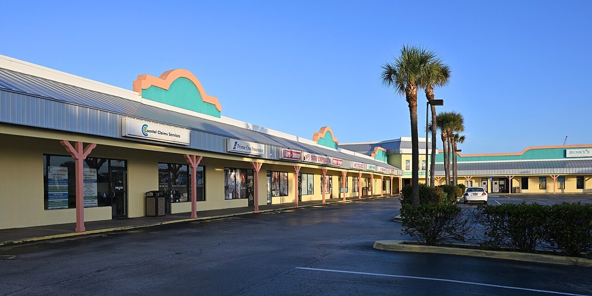 A row of shops and restaurants at a small shopping center in Florida